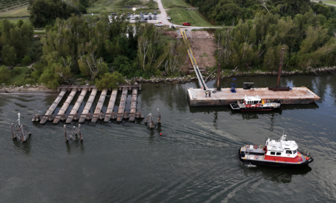 October 9, 2023: An aerial view shows low water levels on the Mississippi River in Belle Chasse, Louisiana, revealing pipes that are typically underwater. The low water levels caused barges and ships to run aground along parts of the Mississippi River in October and created saltwater intrusion concerns in southern Louisiana. (Image credit: Justin Sullivan/Getty Images)